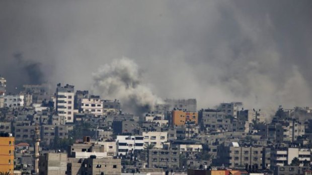 Smoke rises after an Israeli shelling at the Shijaiyah neighborhood in Gaza City. The death toll from the offensive has climbed over 500.