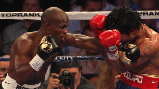 Timothy Bradley lands a left to the head of Manny Pacquiao during their WBO welterweight title fight.