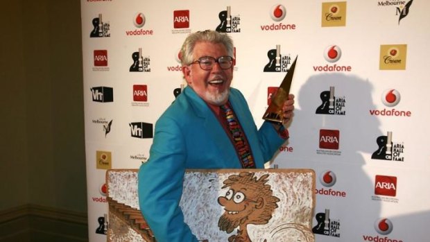 Stripped of award ... Rolf Harris with his ARIA award in 2008.