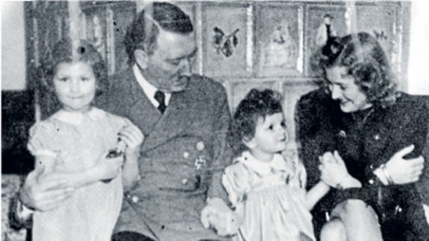 Hitler with Eva Braun and two unknown children.