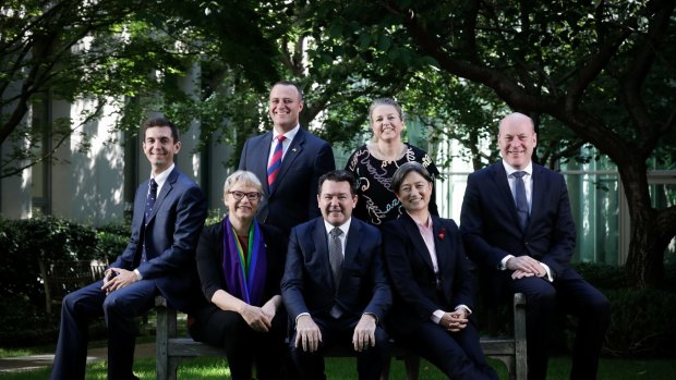 L-R: Trevor Evans, Janet Rice, Tim Wilson, Dean Smith, Louise Pratt, Penny Wong and Trent Zimmerman pose for a photo ahead of the vote on the Marriage Amendment Bill, at Parliament House in Canberra on Thursday 7 December 2017. fedpol Photo: Alex Ellinghausen (Please check with Bevan Shields before using photo)