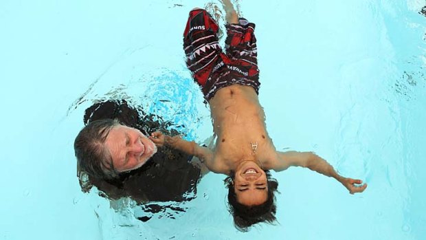 Floating free: George Gittoes teaches actor Arshad Khan how to swim.