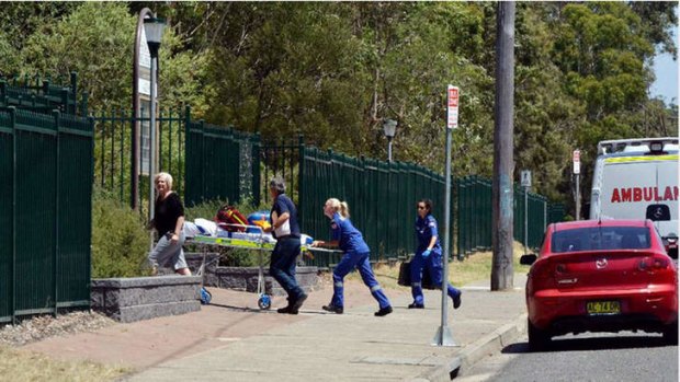 Paramedics arrive at Shoalhaven High School to treat a 14-year-old boy who was stabbed in a classroom.