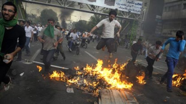 Voting with their feet...opposition supporters run riot in Tehran. There was widespread claims of electoral fraud.