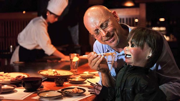 David Strassman feeds Chuck at Japanese Teppanyaki Inn on Collins Street.