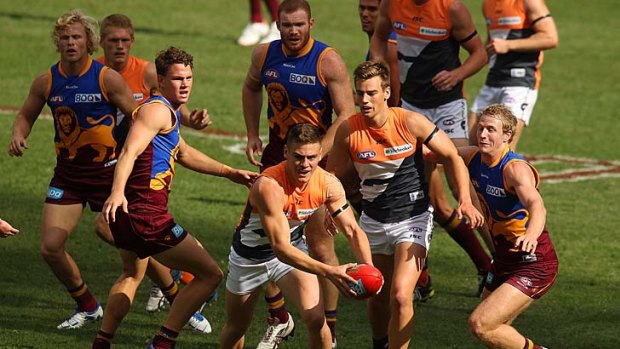 Stephen Coniglio of the Giants hesitates after taking possession.