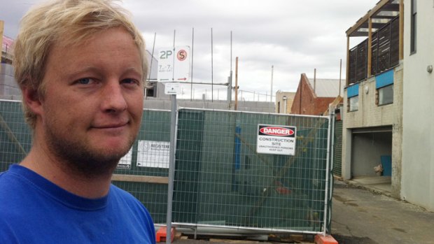 Plumber Adrian Mulder rescued a woman from her balcony after her flat caught fire.