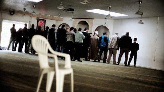 Muslims gather for afternoon prayer at the Grimjohvej mosque: Its leadership has denied it recruits fighters.