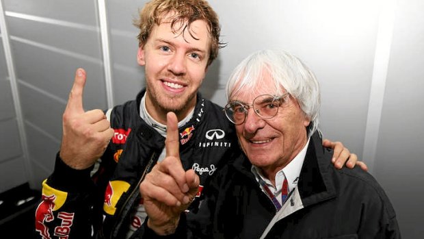 Sebastian Vettel of Red Bull Racing celebrates in his changing room with F1 supremo Bernie Ecclestone in Brazil.