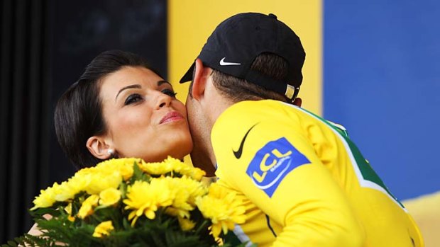 Thomas Voeckler receives a bouquet after retaining the yellow jersey.
