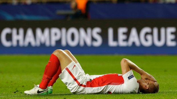 Monaco's Kamil Glik covers his face during the Champions League semifinal first leg soccer match between Monaco and Juventus.