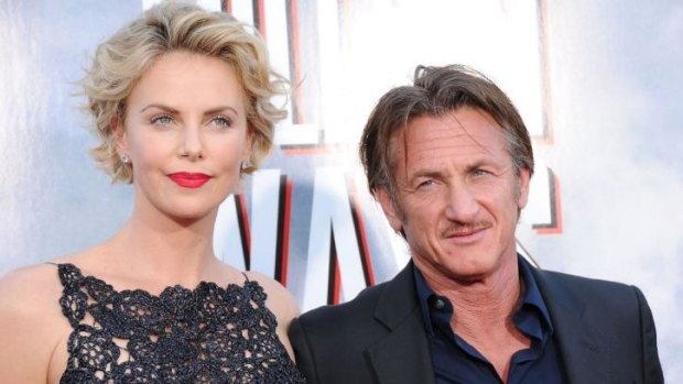 Beauty and grit: Actress Charlize Theron and actor Sean Penn arrive at the Los Angeles Premiere 'A Million Ways To Die In The West'.