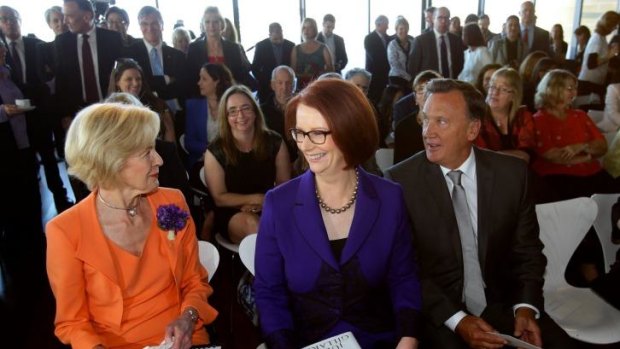 Former prime minister Julia Gillard (centre) with her partner Tim Mathieson (right) and former governor-general Quentin Bryce.