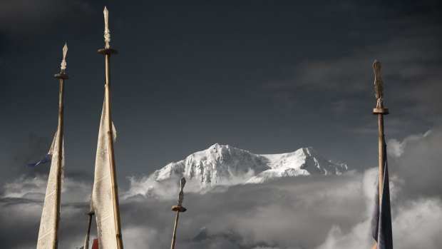 High point: Prayer flags frame the Kanchenjunga peak. 
