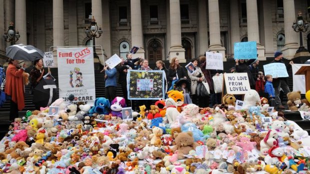 Hundreds of teddy bears on display as families protest against day care funding cuts.