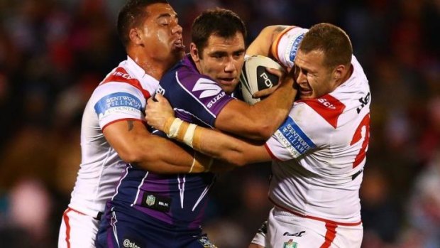 Cameron Smith makes some hard yards against the Dragons on Monday night. 