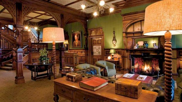 The warm and welcoming Otahuna Lodge lobby at Tai Tapu is filled with antiques.