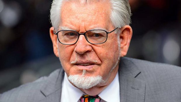 Veteran entertainer Rolf Harris arrives to be sentenced at Southwark Crown Court in London on Friday.