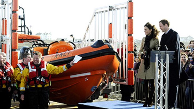 Britain's young royal couple do the honours at a lifeboat launch in north Wales.