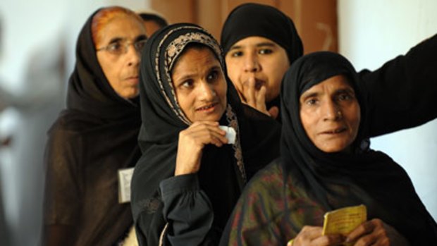 Off to the polls...Indian Muslim women wait in line to cast their vote in Varanasi