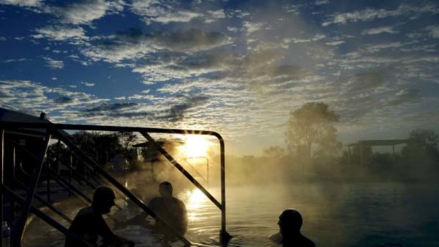 Warm welcome ... the sun rises on Lightning Ridge's hot baths,  a drawcard for  many retirees with aches and pains who make the trek for therapeutic reasons.