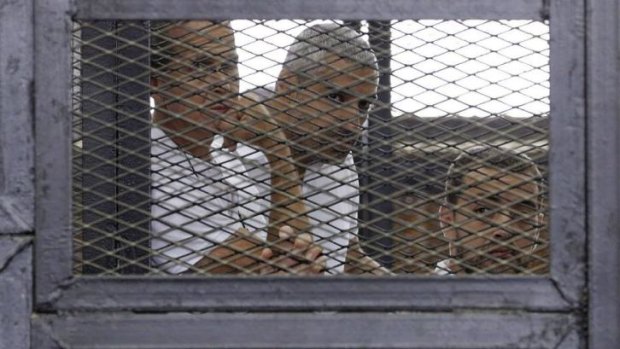 Peter Greste, Mohammed Fahmy and Baher Mohamed during their trial.