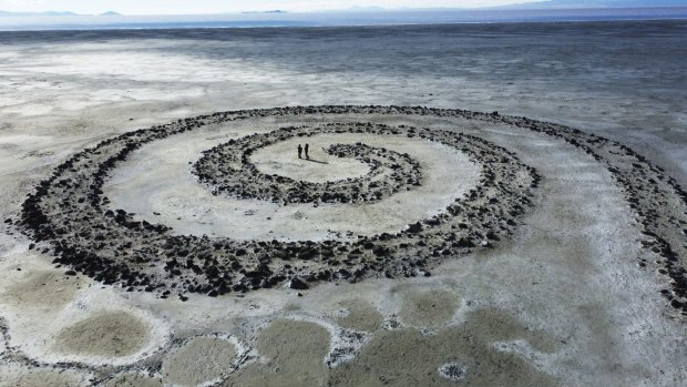 The Great Salt Lake is seen behind the earthwork Spiral Jetty by Robert Smithson.