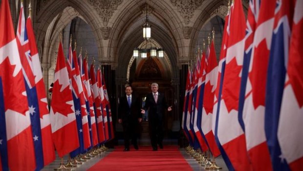 Prime Minister Tony Abbott and Canadian Prime Minister Stephen Harper walk the Hall of Honour earlier this year.
