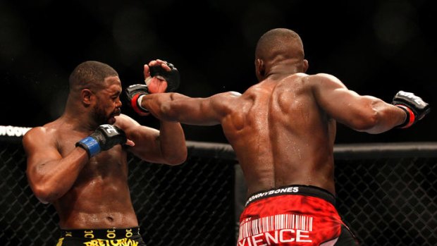 Jon Jones (right) punches Rashad Evans during their light heavyweight title bout for UFC 145 at the Philips Arena in Atlanta, Georgia.