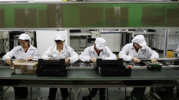 Workers are seen inside a Foxconn factory in the township of Longhua in the southern Guangdong province, in this file picture taken May 26, 2010
