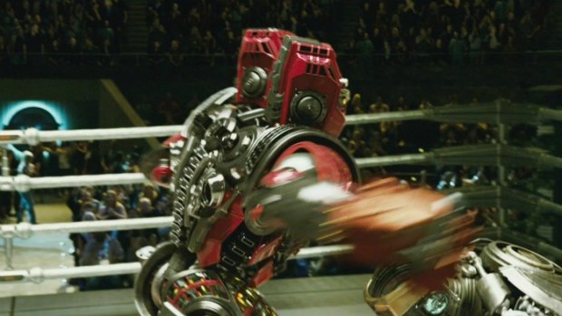 Duck & cover: one robot takes a swing at another robot in the robot boxing movie <i>Real Steel</i>. The film also features non-robot characters played by Hugh Jackman and Hope Davis.