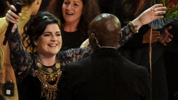 Winner of The Voice Karise Eden hugs Seal after winning the competition during a live recording in Sydney.