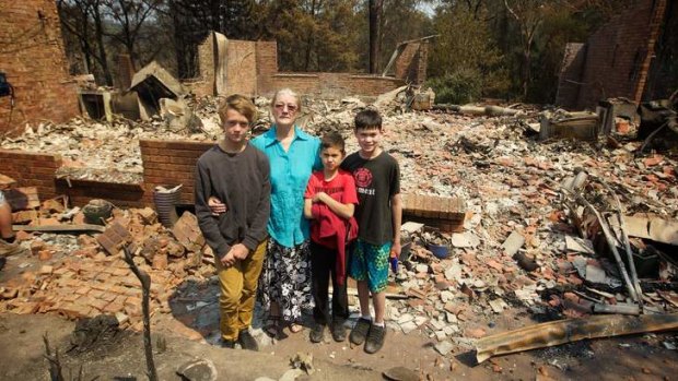 Lost her home: Mary Love and her grandchildren.