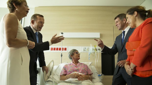 Mike Baird, right, with his wife Kerryn and Tony Abbott, left, with his wife Margie visit breast cancer patient Lyn Marvey at the Chris O'Brien Lifehouse Hospital in February.