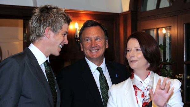 Good humour ... Julia Gillard with her partner, Tim Mathieson, and the Australian captain, Tim Paine.