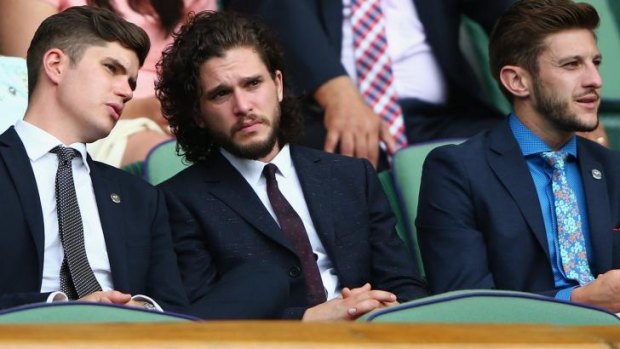 Harington sat with Liverpool and England footballer Adam Lallana, right, on Centre Court at day four of Wimbledon.