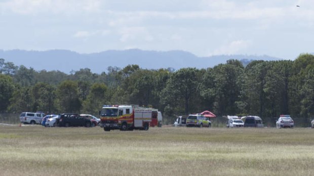 Emergency crews at the scene of a light plane crash at Caboolture Airport.