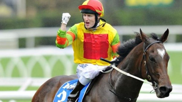 Craig Newitt celebrates after winning the T.J. Smith Stakes on Lankan Rupee on day one of The Championships at Randwick.