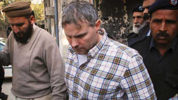 Raymond Davis is escorted from a Lahore court.