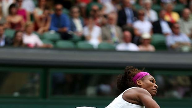 Raw power: Serena Williams sends down another ace.