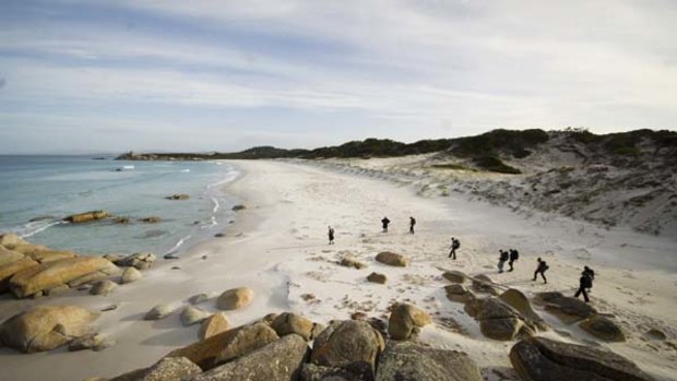 Eco-luxe ... hikers on the beach.