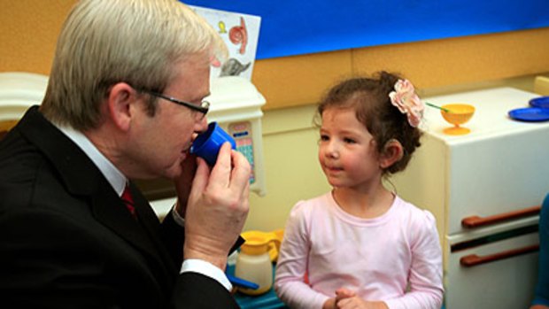 Would you like sugar with that? ... Kevin Rudd settles in for Christa Dracopoulous's tea party at the Shepherd Centre yesterday.