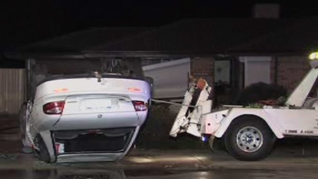 Emergency services work to remove the vehicle. <i>Photo: Channel Ten</i>