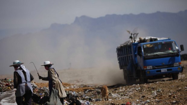 Women gather unrecycled rubbish at a dump outside Cochabamba where the World People's Conference on Climate Change and the Rights of Mother Earth is being held.