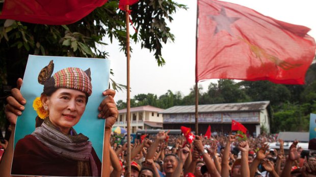 National League for Democracy (NLD) supporters hold up a picture of Aung San Suu Kyi while celebrating their victory in Burma's parliamentary elections.