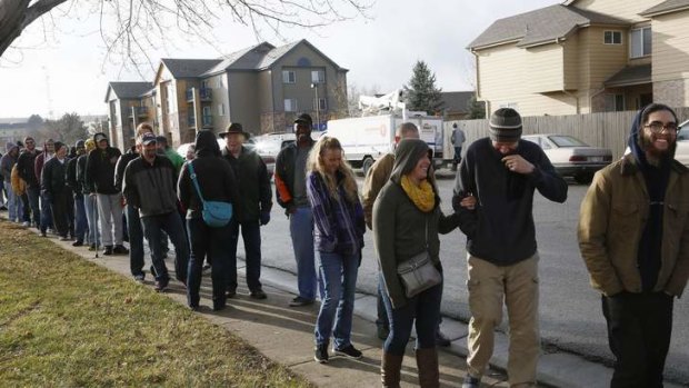 People wait in line to be among the first to legally buy recreational marijuana at the Botana Care store in Northglenn, Colorado January 1, 2014.