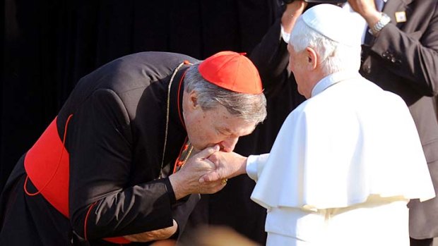 Cardinal George Pell kisses Pope Benedict XVI?s hand in Sydney in 2008.