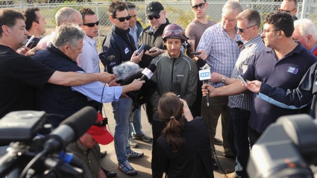 Jockey Damien Oliver talks to media after a trackwork session at Werribee.