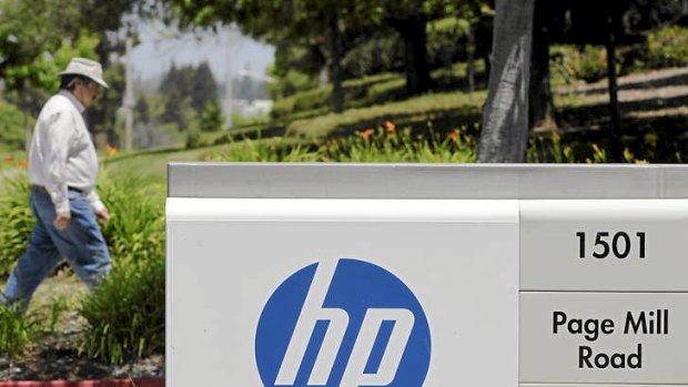 A worker walks into HP's headquarters in Palo Alto, California. The company held is annual customer event in Las Vegas this week.