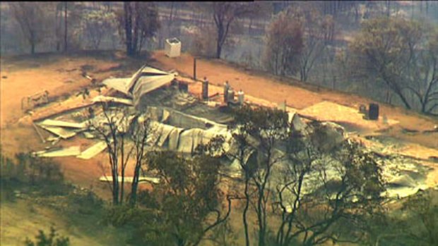 A property at Toodyay lies in ruins after the fire passed through.